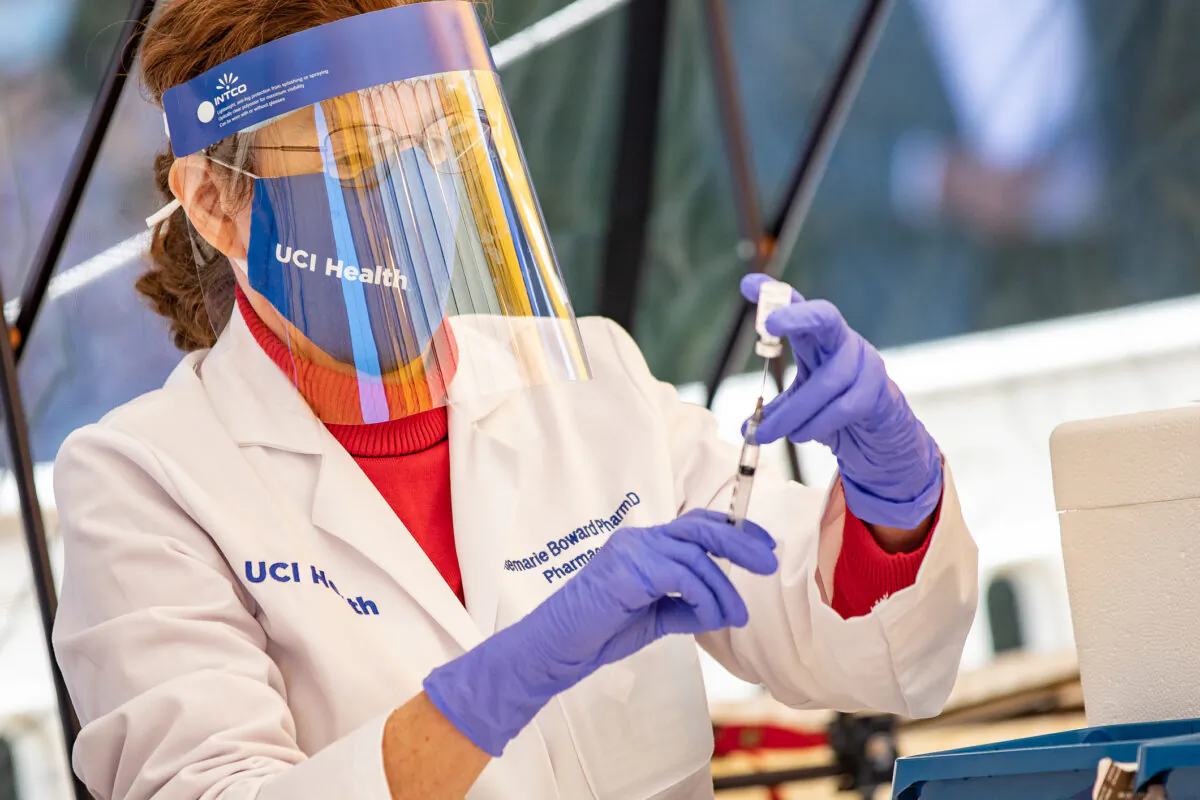 A medical worker prepares the COVID-19 vaccination at the University of California–Irvine Medical Center, in Orange, Calif., on Dec. 16, 2020. (John Fredricks/The Epoch Times)