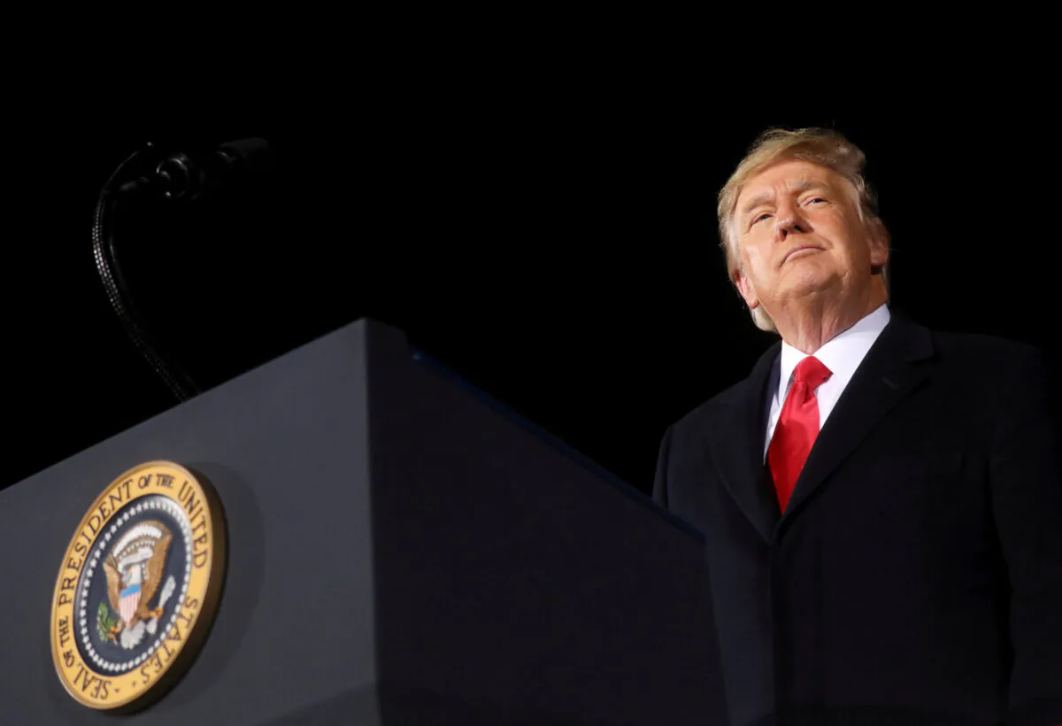 President Donald Trump addresses a campaign rally on the eve of the run-off election to decide both of Georgia's Senate seats in Dalton, Ga., on Jan. 4, 2021. (Leah Millis/Reuters)