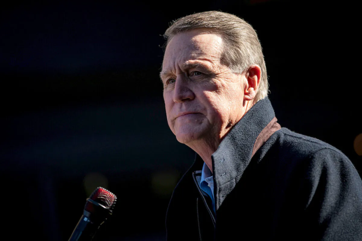 Sen. David Perdue (R-Ga.) attends a campaign event as he runs for reelection at the Olde Blind Dog Irish Pub, in Milton, Ga.,, on Dec. 21, 2020. (Al Drago/Reuters)