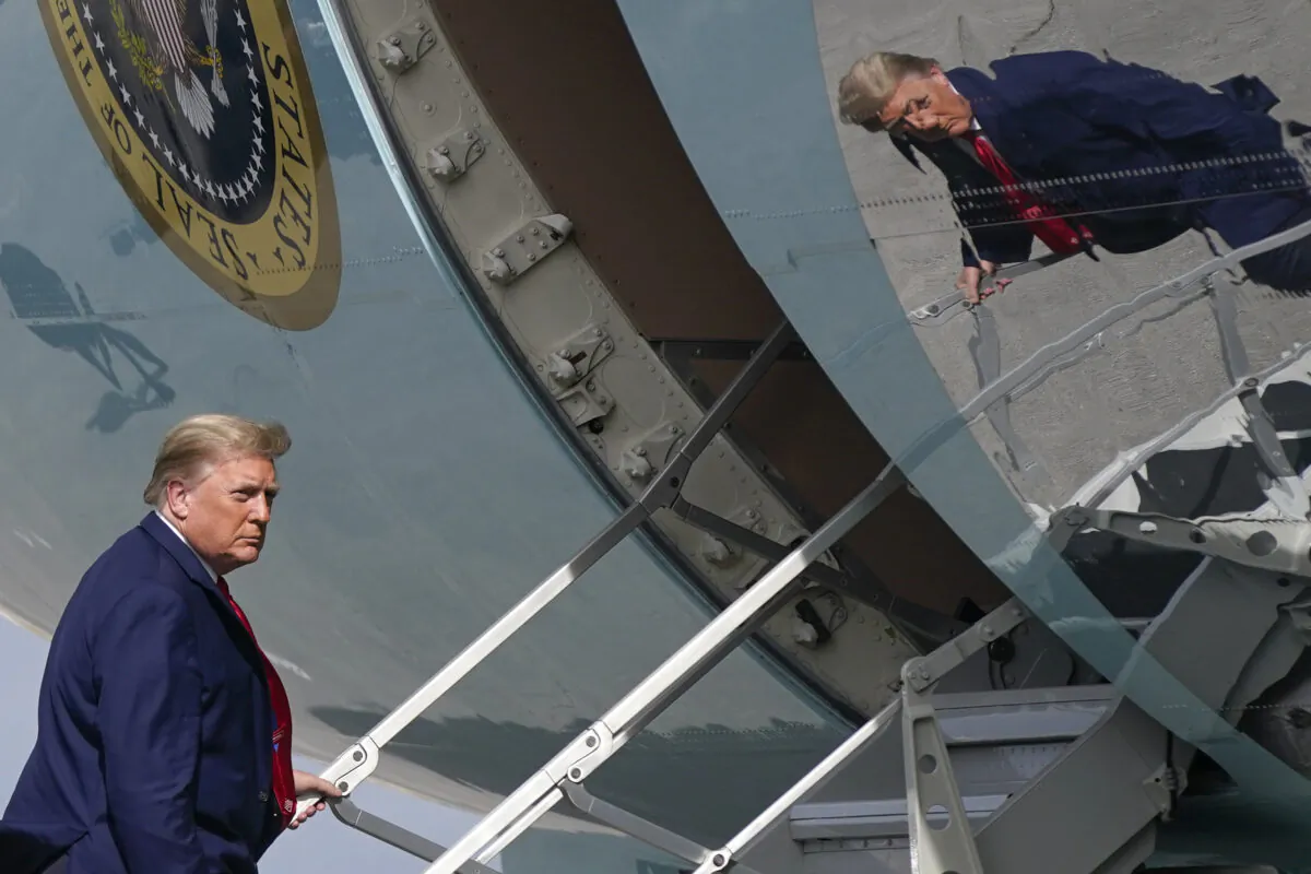 President Donald Trump boards Air Force One at Palm Beach International Airport, in West Palm Beach, Fla., on Dec. 31, 2020. (Patrick Semansky/AP Photo)