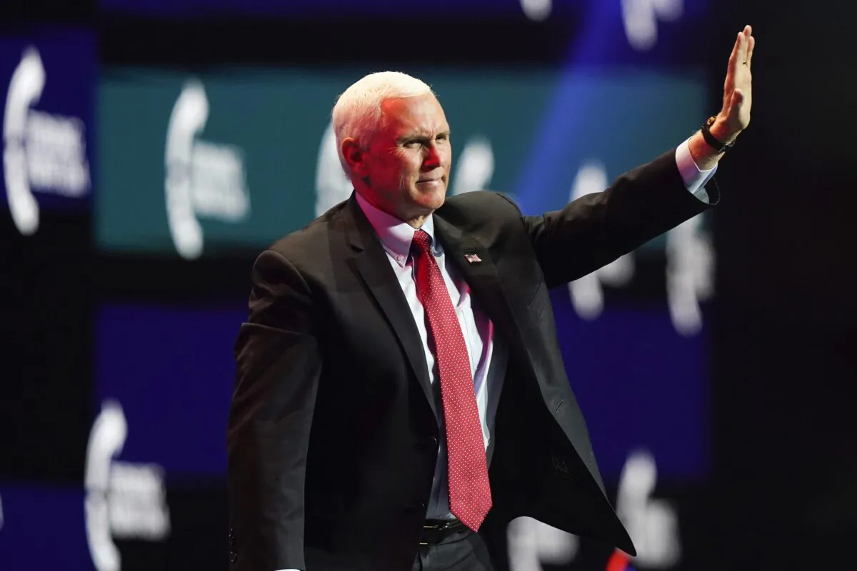 Then Vice President Mike Pence waves as he walks off the stage after speaking at the Turning Point USA Student Action Summit in West Palm Beach, Fla., on Dec. 22, 2020. (Lynne Sladky/AP Photo)
