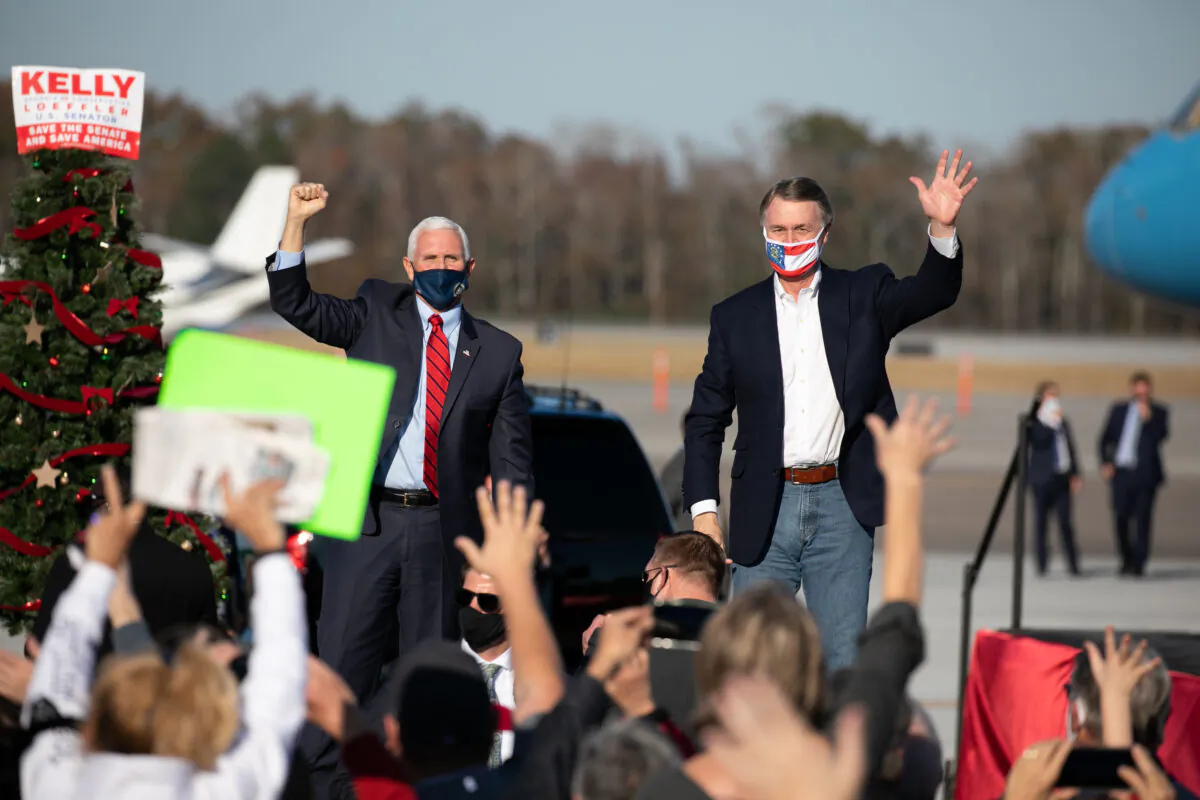 Vice President Mike Pence and Sen. David Purdue (R-GA) wave to the crowd during a rally in support of Purdue and Sen. Kelly Loeffler (R-GA) in Augusta, Georgia, on Dec. 10, 2020. (Jessica McGowan/Getty Images)