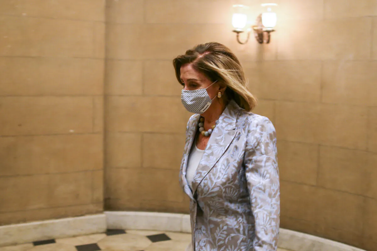 Rep. Nancy Pelosi (D-Calif.) walks in the U.S. Capitol in Washington on Jan. 3, 2021. (Tasos Katopodis/Getty Images)