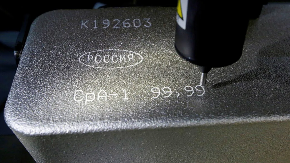 A machine engraves information on an ingot of 99.99 percent pure silver at the Krastsvetmet non-ferrous metals plant, one of the world’s largest producers in the precious metals industry, in the Siberian city of Krasnoyarsk, Russia, on Oct. 24, 2016. (Ilya Naymushin/Reuters)