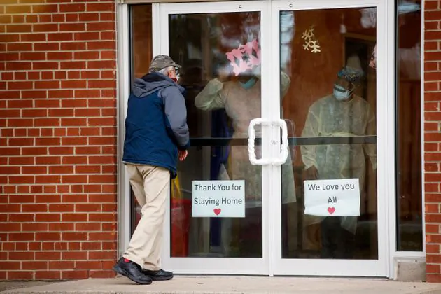 A man attempts to visit a family member at a long-term care home in Toronto on May 10, 2020. (Cole Burston/Getty Images)