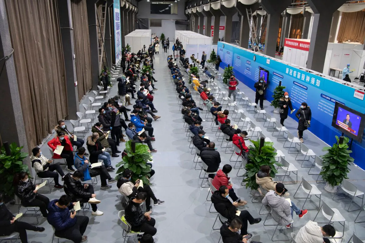 People are waiting to receive COVID-19 vaccines at a temporary vaccination centre in Beijing, China, on Jan. 3, 2021. (STR/CNS/AFP via Getty Images)