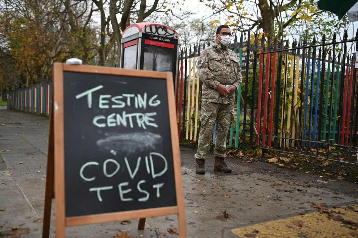 A chalk board sign is seen on the street outside a testing centre staffed by British Army soldiers in Liverpool, on Nov. 10, 2020, during a city-wide mass testing pilot operation.(Oli Scarff/AFP via Getty Images)