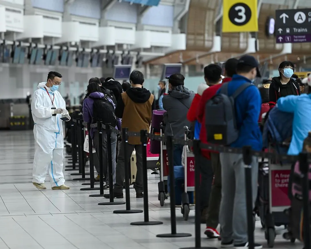 People line up and check in for an international flight at Pearson International Airport during the COVID-19 pandemic in Toronto on Oct. 14, 2020. (The Canadian Press/Nathan Denette)
NATHAN DENETTE / THE CANADIAN PRESS