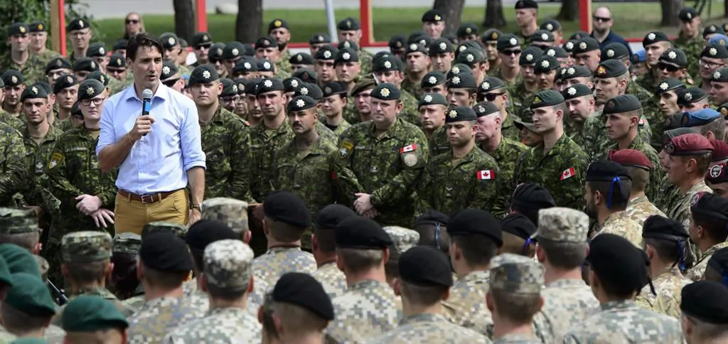 Prime Minister Justin Trudeau addresses the troops at Adazi Military Base in Kadaga, Latvia, on July 10, 2018. (The Canadian Press/Sean Kilpatrick) 