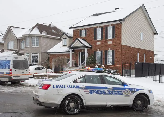 Police on scene at a home in Laval, Que., on Jan. 4, 2021, where a Quebec girl was found  in cardiorespiratory arrest and later pronounced dead. (The Canadian Press/Ryan Remiorz)