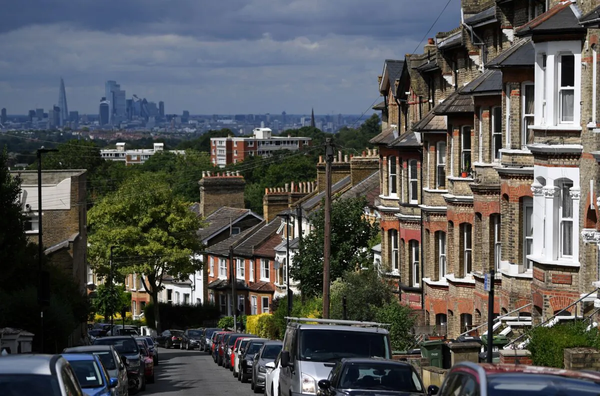Rows of terraced houses and residential properties are pictured in south London, backdropped by the skyline of the City of London, on July 6, 2020. (Daniel Leal-Olivas/AFP via Getty Images)