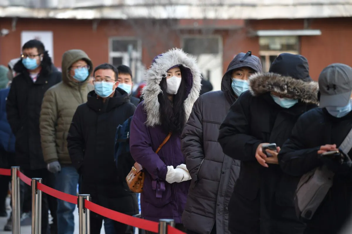 People line up to be tested for the COVID-19 outside a hospital in Beijing, China on Jan. 5, 2021. (GREG BAKER/AFP via Getty Images)