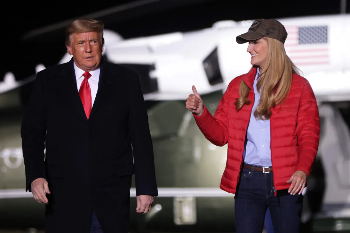 U.S. President Donald Trump arrives with Sen. Kelly Loeffler (R-GA) at a campaign rally at Dalton Regional Airport in Dalton, Ga., on Jan. 4, 2021. (Alex Wong/Getty Images)