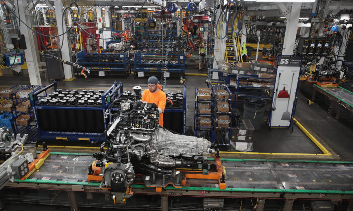 Workers assemble Ford vehicles at the company's assembly plant in Chicago, on June 24, 2019. (Scott Olson/Getty Images)