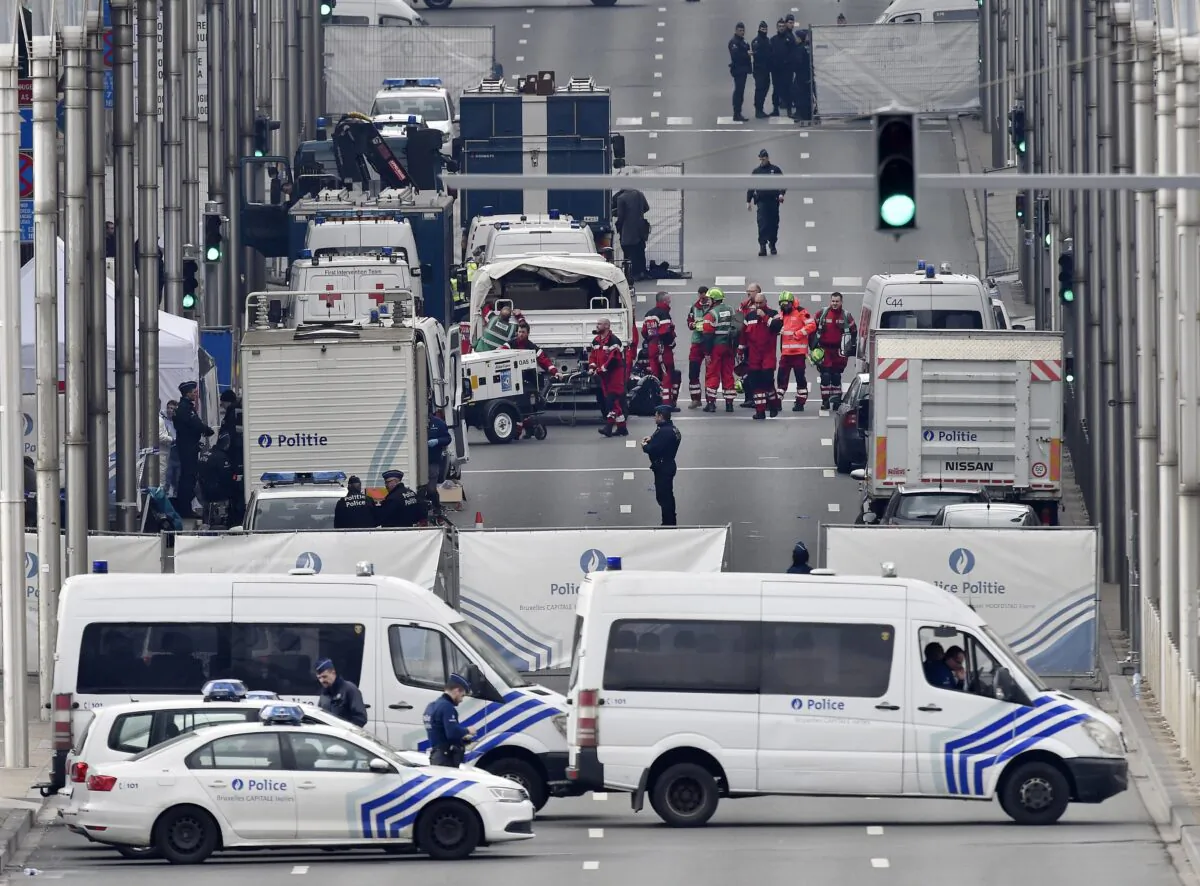 Police and rescue teams outside the metro station Maelbeek after an attack in Brussels on March 22, 2016. (Martin Meissner/AP Photo)