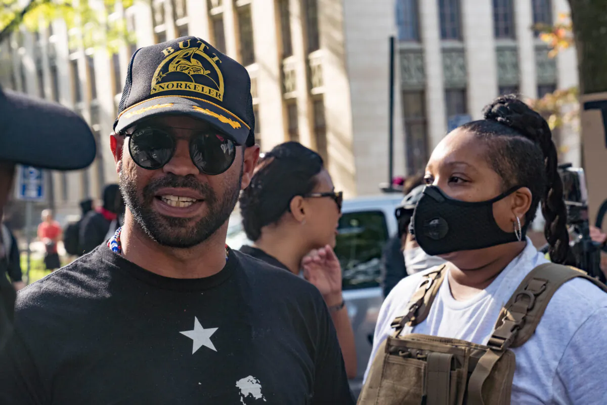 Enrique Tarrio, head of the Proud Boys, is escorted out of the area after arguing with counter-protestors at a 'Stop the Steal' protest outside of the Georgia State Capital building in Atlanta, Ga., on Nov. 21, 2020. (Megan Varner/Getty Images)