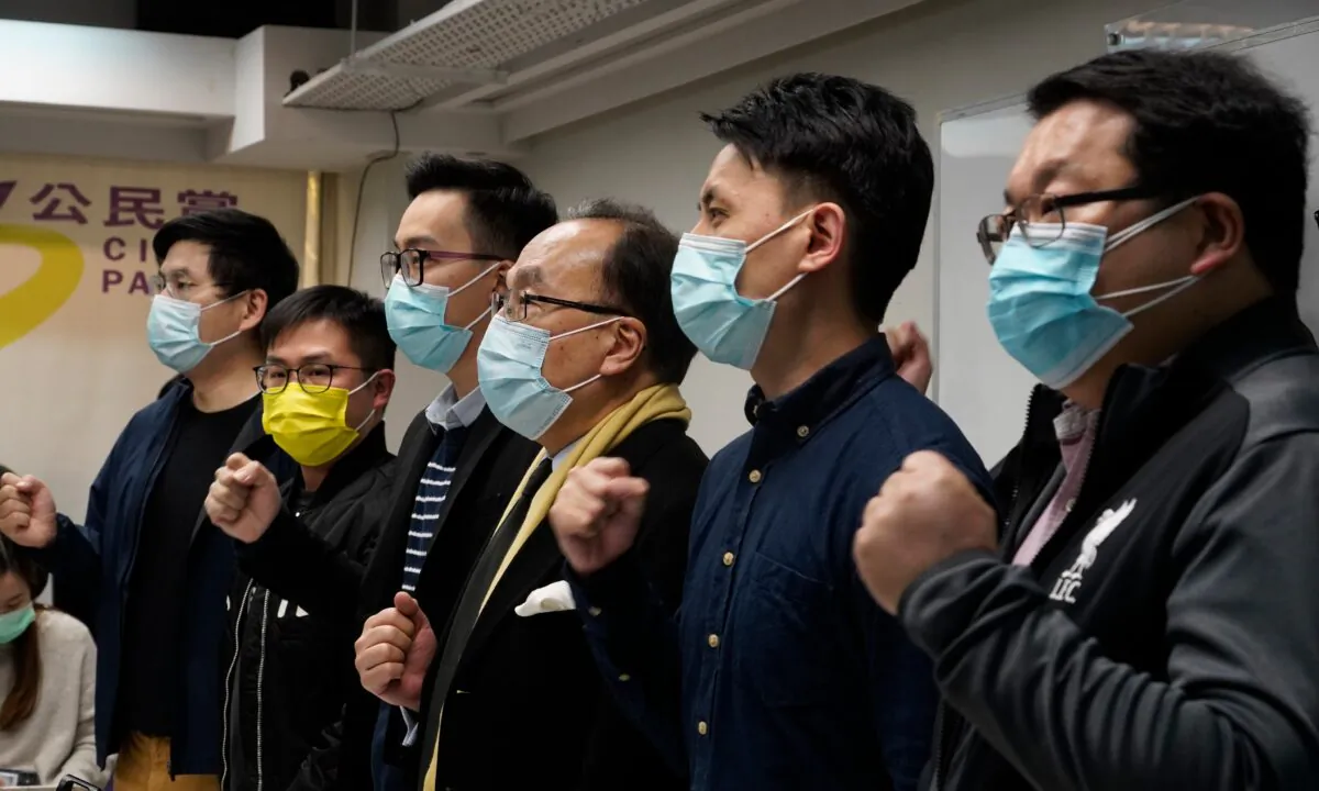 Pro-Democratic Party members shout slogans in response to the mass arrests during a press conference in Hong Kong, on Jan. 6, 2021. (Vincent Yu/AP Photo)