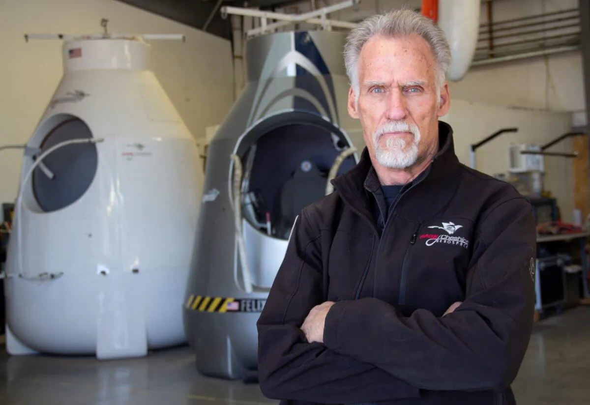 Art Thompson, CEO of Sage Cheshire and president of A2ZFX, stands in front of two model capsules he built for Red Bull Stratos. On Oct. 14, 2012, Felix Baumgartner used Thompson’s capsule as a launch pad and broke the sound barrier, reaching Mach 1.25, breaking the record for the highest freefall, largest manned balloon, and highest balloon flight. The famous capsule was featured at the Smithsonian in 2014. (Linda KC Reynolds)