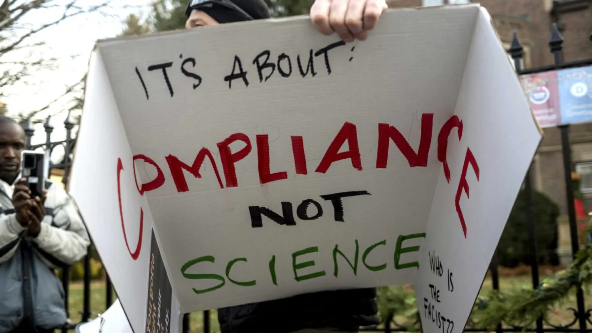 A man addresses a crowd of protesters rallying outside the Governor's Mansion in St. Paul, Minn., on Dec. 5, 2020. (Stephen Maturen/Getty Images)
