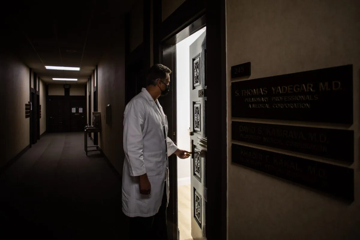 Medical director of the intensive care unit Dr. Thomas Yadegar works at night at his personal office in Tarzana, Calif., after finishing his 12-hour shift at Providence Cedars-Sinai Tarzana Medical Center, on January 3, 2021. - (Photo by APU GOMES/AFP via Getty Images)