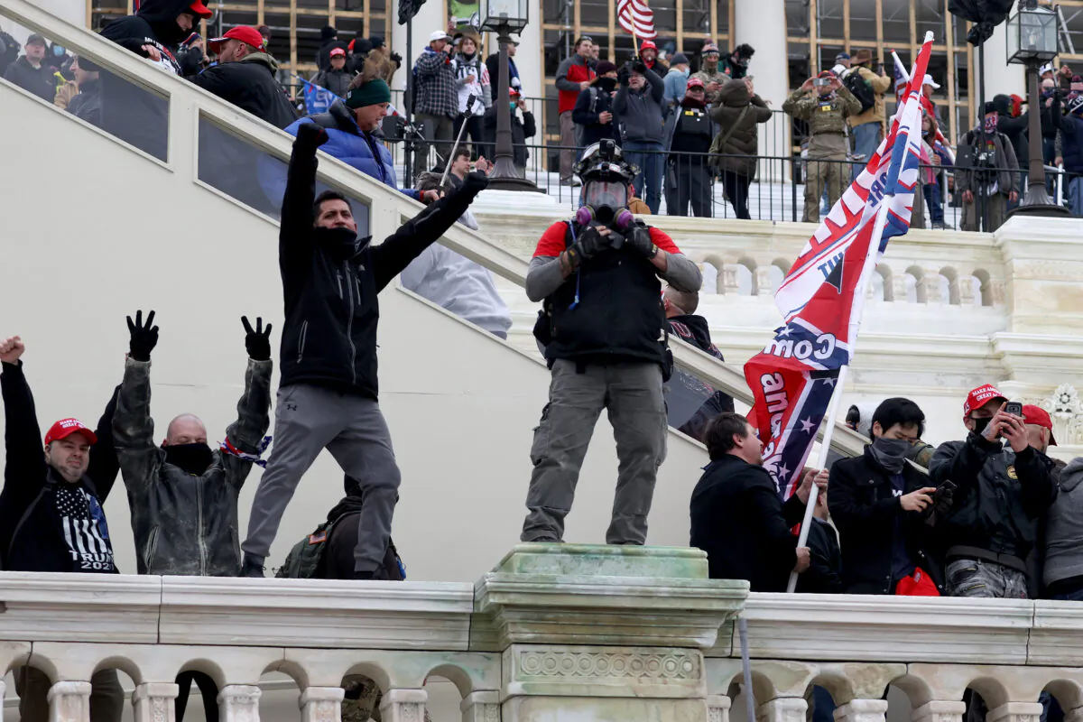 Protesters gather on the U.S. Capitol Building in Washington on Jan. 6, 2021. A group of riots entered the U.S. Capitol building after mass demonstrations in the nation's capital during a joint session of Congress to count Electoral College votes. (Tasos Katopodis/Getty Images)