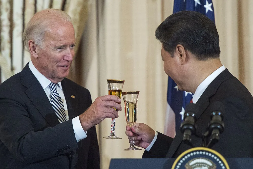 Then-U.S. Vice President Joe Biden and Chinese leader Xi Jinping toast during a state luncheon for China in Washington on Sept. 25, 2015. (Paul J. Richards/AFP via Getty Images)