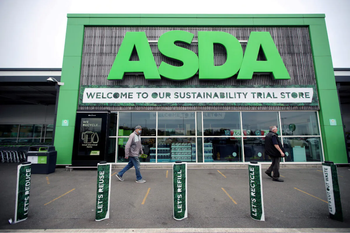 Shoppers walking past the UK supermarket Asda in Leeds, United Kingdom, on Oct. 19, 2020. (Molly Darlington/Reuters)