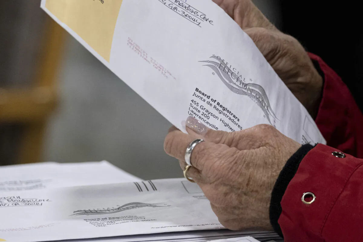 Workers at the Gwinnett County Georgia elections headquarters process absentee ballots for Georgia's Senate runoff election in Lawrenceville, Ga., on Jan. 6, 2021. (Ben Gray/AP Photo)