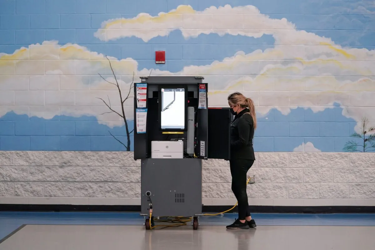 Voters cast their ballots in Georgia’s Senate runoff elections at a Fulton County polling station in Atlanta, Ga., on Jan. 5, 2021. (Elijah Nouvelage/Reuters)