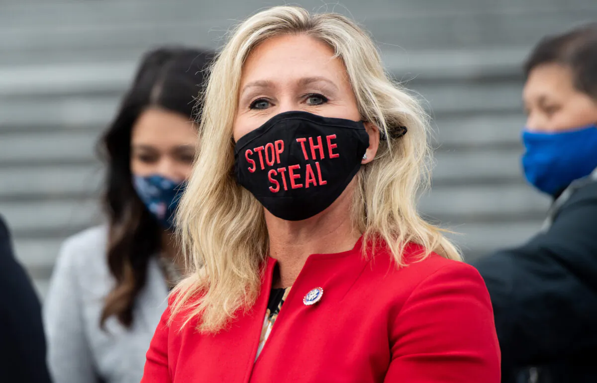 Rep. Marjorie Taylor Greene (R-Ga.) is seen while speaking with fellow first-term Republican members of Congress on the steps of the U.S. Capitol in Washington on Jan. 4, 2021. (Saul Loeb/AFP via Getty Images)