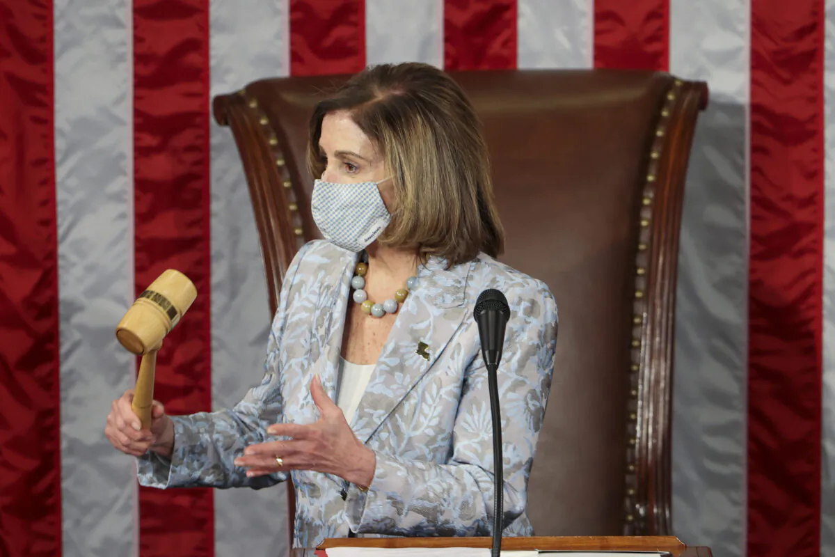 House Speaker Nancy Pelosi (D-Calif.) holds a gavel during the first session of the 117th Congress in the House Chamber at the U.S. Capitol in Washington on Jan. 3, 2021. (Tasos Katopodis/Pool/AFP via Getty Images)
