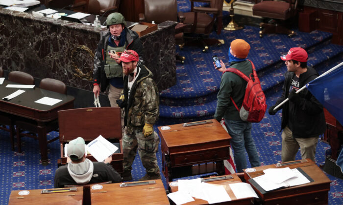 Protesters enter the Senate Chamber in Washington on Jan. 6, 2021. (Win McNamee/Getty Images)