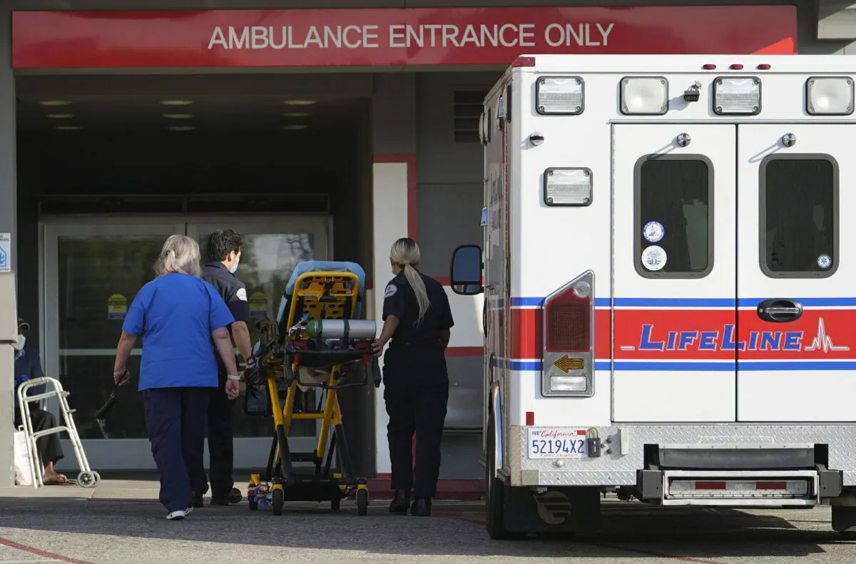 A LifeLine Ambulance arrives at the CHA Hollywood Presbyterian Medical Center (CHA HPMC) in Los Angeles on Jan. 5, 2021. (Damian Dovarganes/AP Photo)