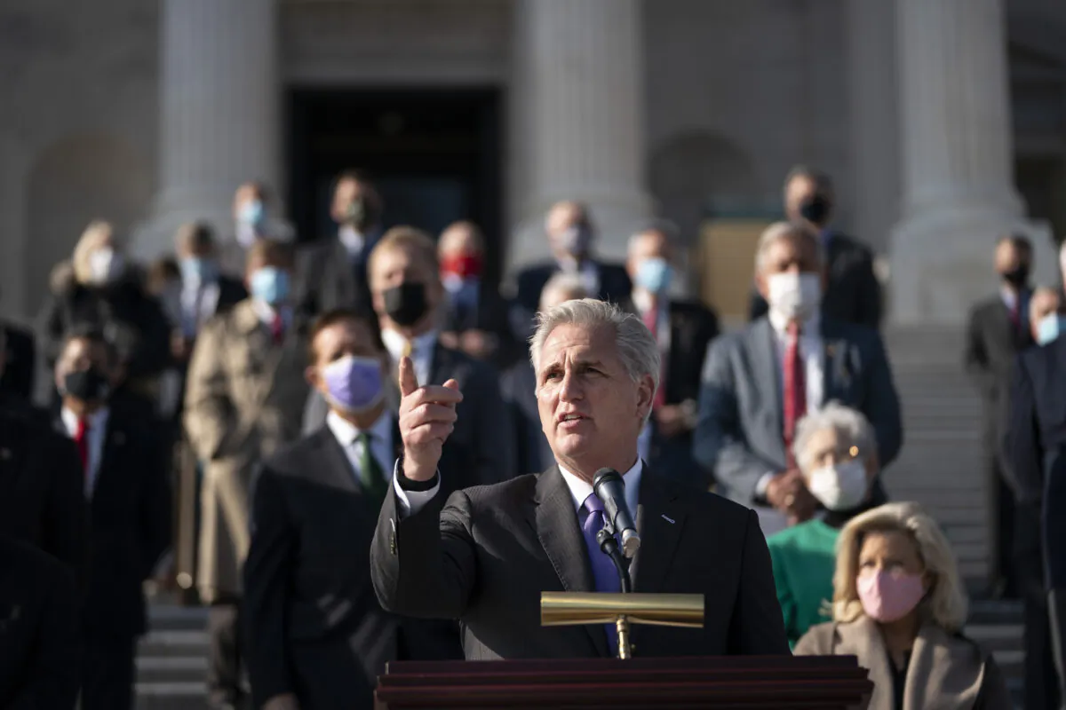 House Minority Leader Kevin McCarthy (R-Calif.), surrounded fellow House Republicans, speaks during a news conference outside the U.S. Capitol in Washington on Dec. 10, 2020. (Drew Angerer/Getty Images)