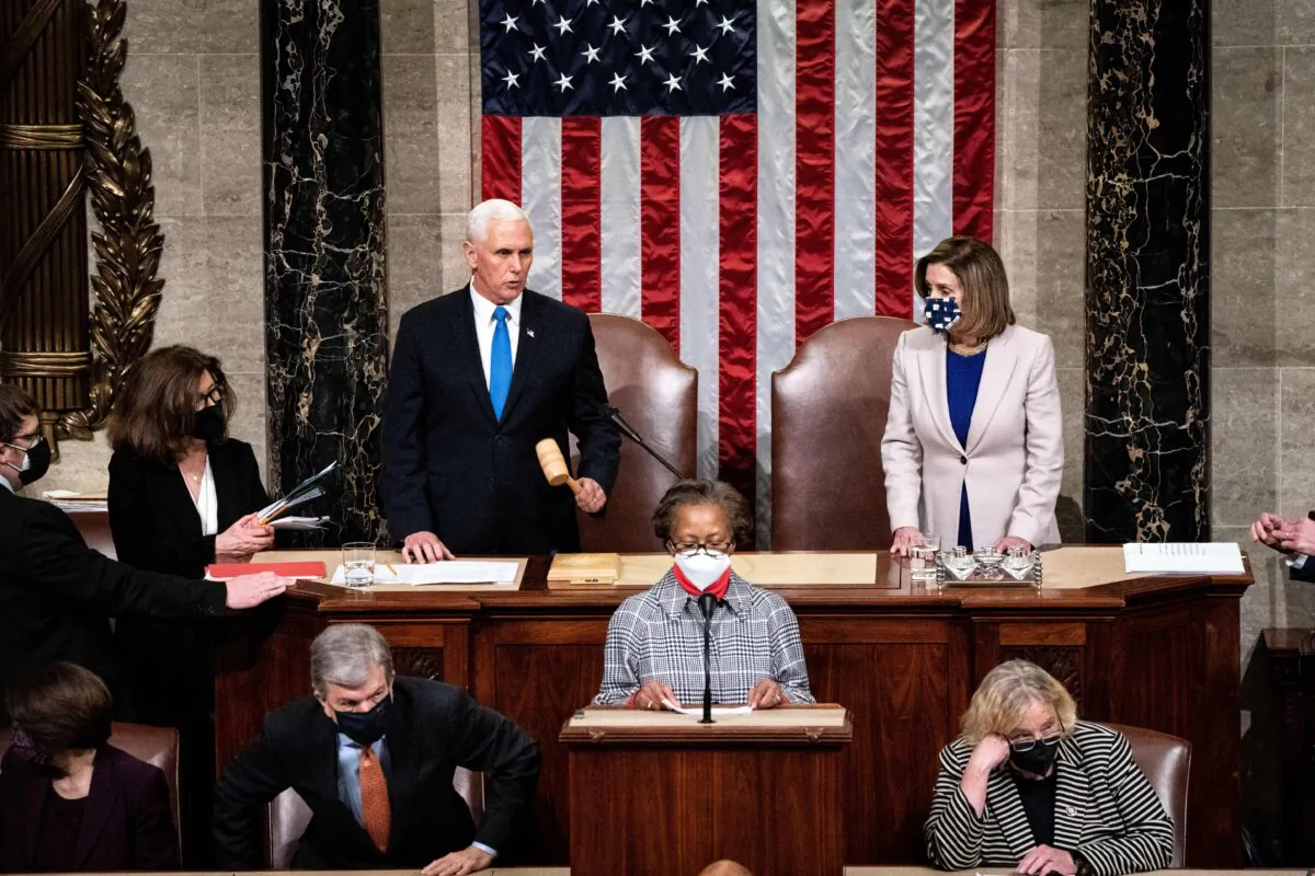 Vice President Mike Pence and House Speaker Nancy Pelosi (D-Calif.) preside over a joint session of Congress to certify the 2020 Electoral College results in Washington on Jan. 6, 2020. (Erin Schaff/Pool/AFP via Getty Images)