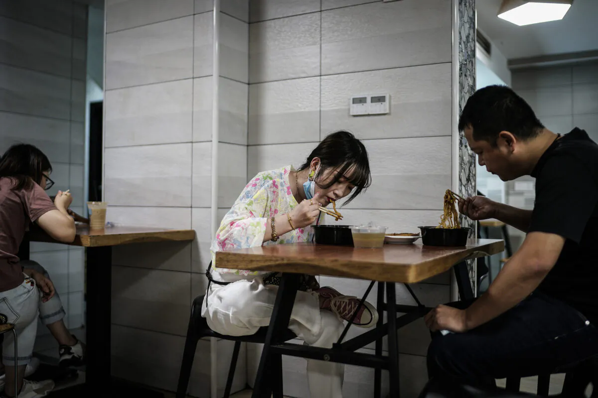People eat noodles in a restaurant in Wuhan city, Hubei Province, China, on Sept. 16, 2020. (Getty Images)