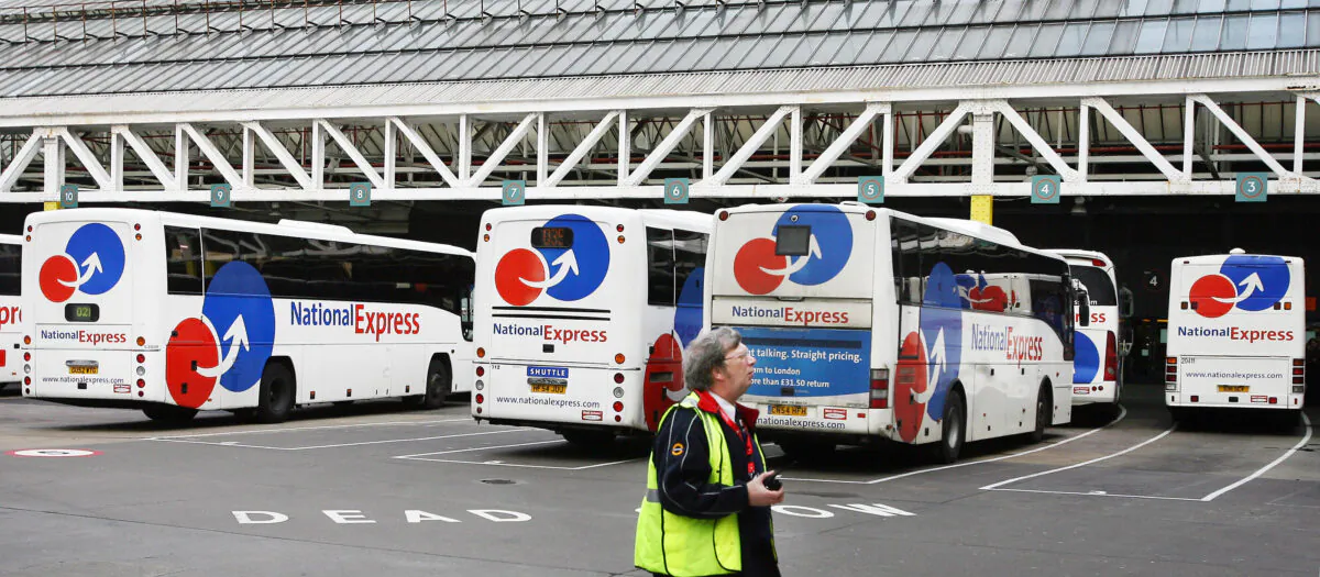 National Express buses stand in the parking bays at Victoria Coach Station in central London on Jan. 4, 2007. (Adrian Dennis/AFP via Getty Images)