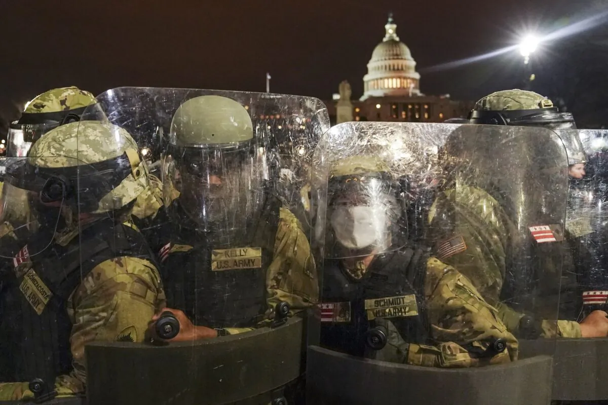 DC National Guard personnel stand outside the U.S. Capitol in Washington on Jan. 6, 2021. (John Minchillo/AP Photo)