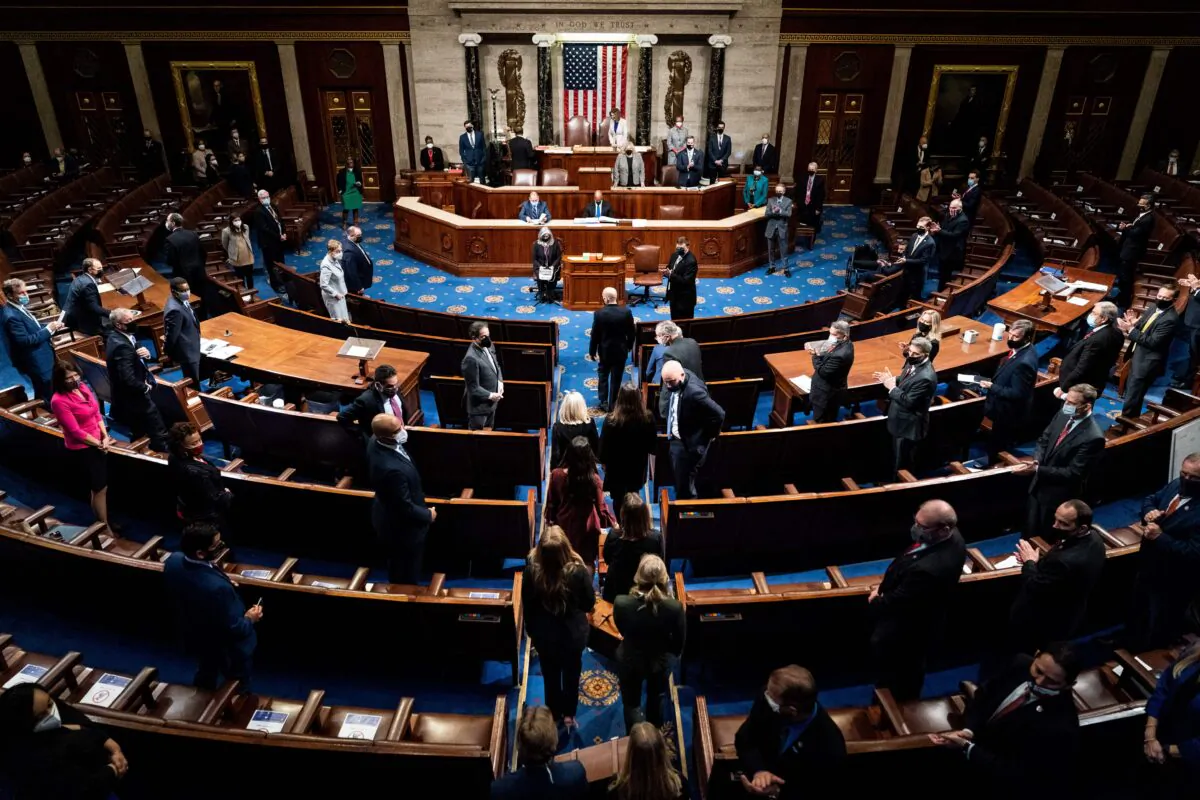 Electoral College votes are brought in before House Speaker Nancy Pelos (D-Calif.) and Vice President Mike Pence esume presiding over a Joint session of Congress to certify the 2020 Electoral College results, in Washington on Jan. 6, 2021. (Erin Schaff/Pool/AFP via Getty Images)