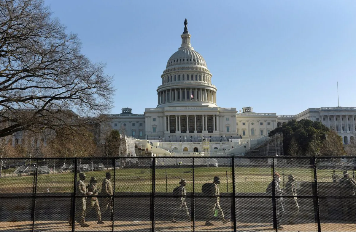 Workers begin to clean up the debris and damage caused by protesters, in the Capitol building in Washington on Jan. 7, 2021. (Samuel Corum/Getty Images)