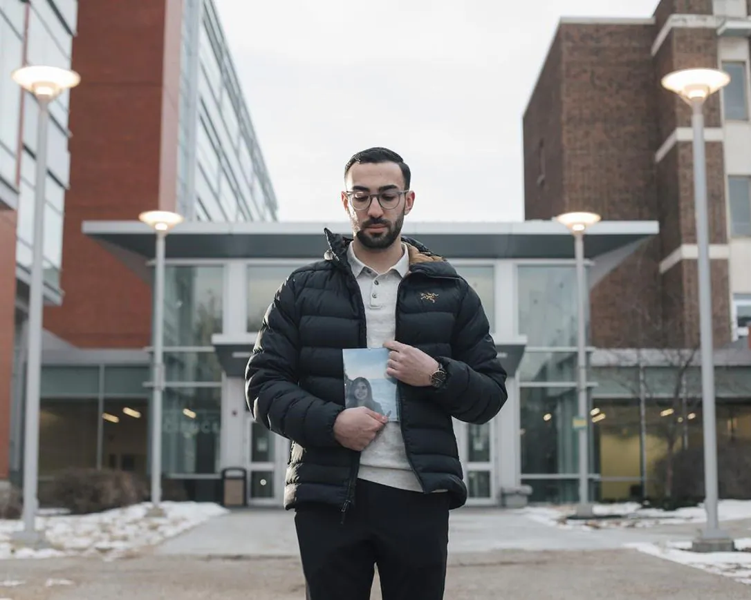 Daniel Ghods holds a photo of his girlfriend Saba Saadat, who died in the crash of Ukraine International Airlines Flight 752, in Edmonton on Dec. 31, 2020. (The Canadian Press/Amber Bracken)