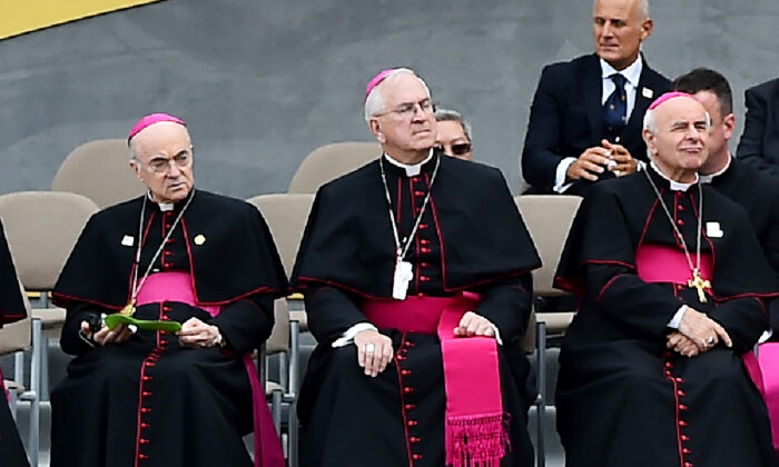 Vatican ambassador to the United States Carlo Maria Vigano (L) and Vincenzo Paglia (R) listen to Pope Francis speaking at Independence Hall in Philadelphia, Pa., on Sept. 26, 2015. (Vincenzo Pinto/AFP via Getty Images)