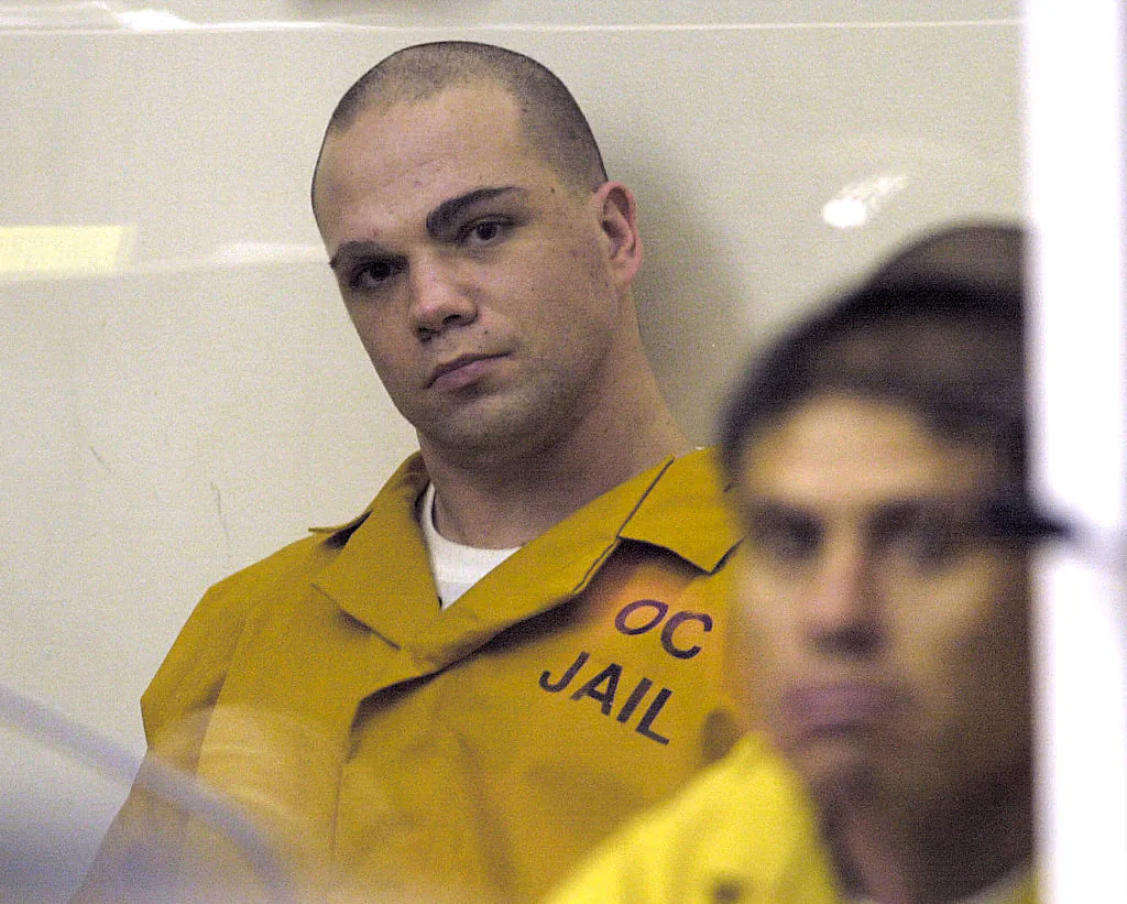 Alastair Irvine, son of a British judicial official, looks out from behind glass during his arraignment at Santa Ana California Superior Court on September 3, 2002 in Santa Ana, California. (Photo by Frazer Harrison/Getty Images)