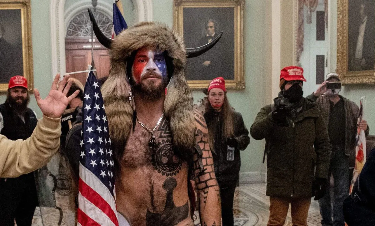 Jacob Chansley (C) entered the Capitol building during a protest with his painted face and horned hat in Washington, on Jan. 6, 2021. (Saul Loeb/AFP via Getty Images)