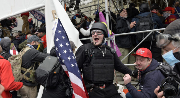 A man calls on people to raid the building
