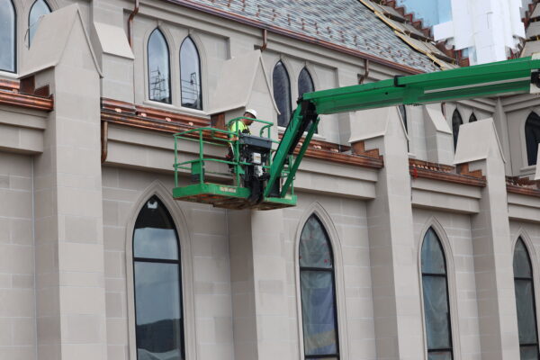 working on the exterior of Christ the King Chapel