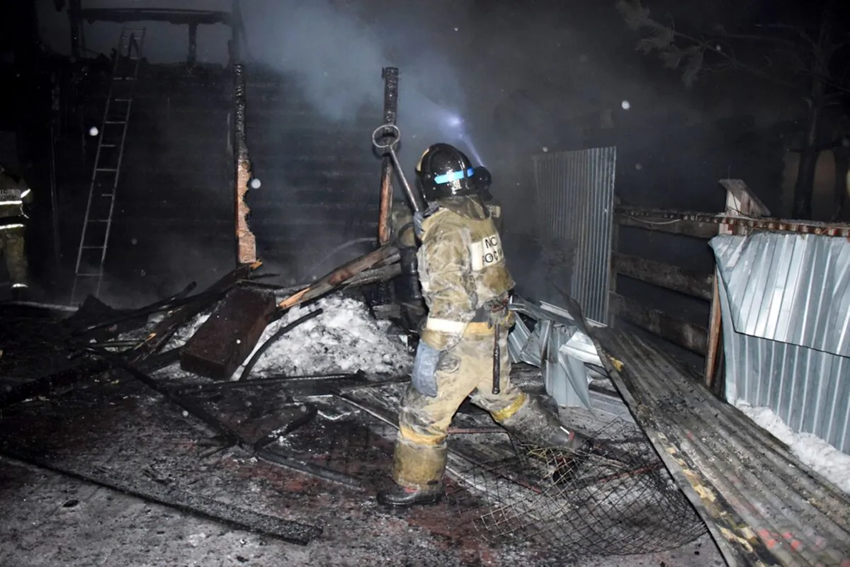 Firefighters work at the site of fire of a nursing home in the town of Borovsky, western Siberia, Russia, on Jan. 9, 2021. (Russian Ministry of Emergency Situations press service via AP)