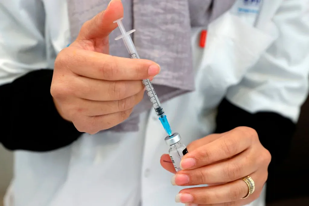 A healthcare worker prepares a dose of COVID-19 vaccine at Maccabi Health Services in the Israeli coastal city of Herzliya, north of Tel Aviv, on Dec. 21, 2020. (Jack Guez/AFP via Getty Images)