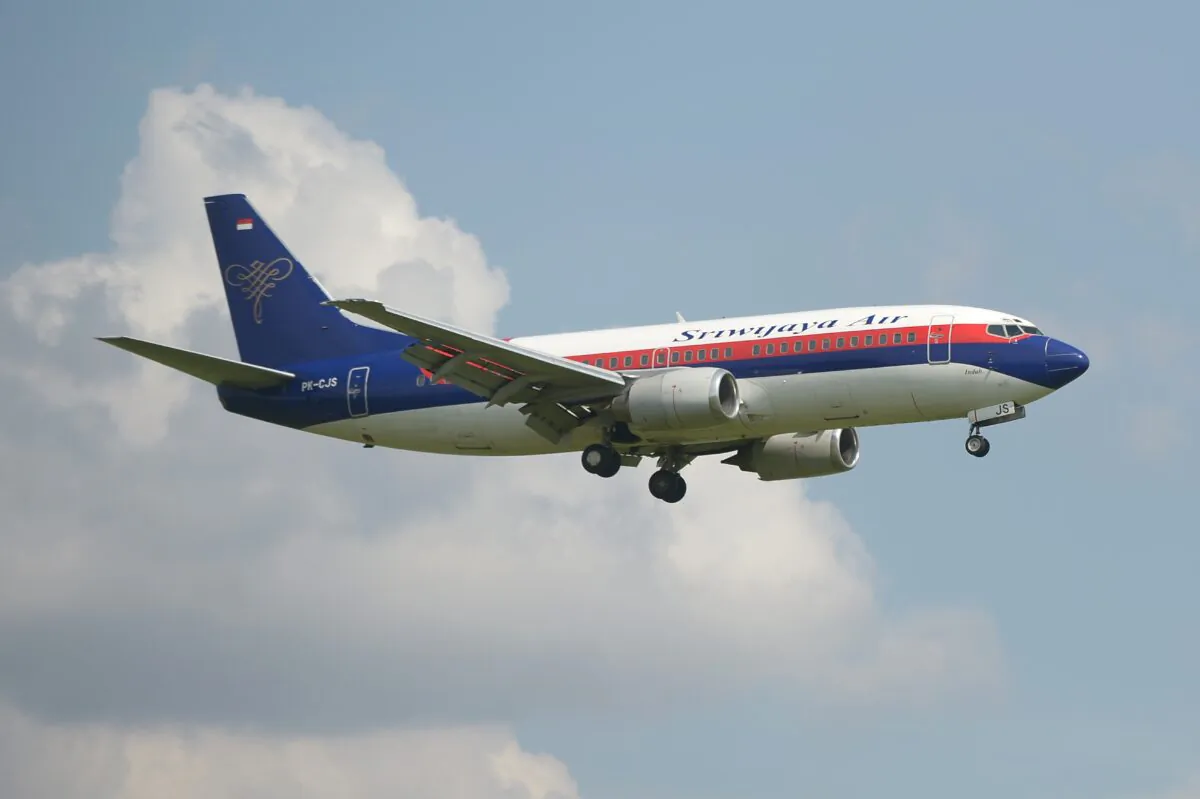 This picture taken in Tangerang on March 18, 2013 shows an Indonesian Sriwijaya air plane preparing for landing over the Sukarno-Hatta airport in Tangerang. (Adek Berry/AFP via Getty Images)