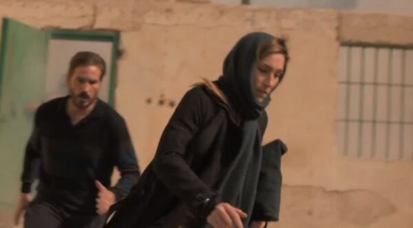 couple running in dark clothes